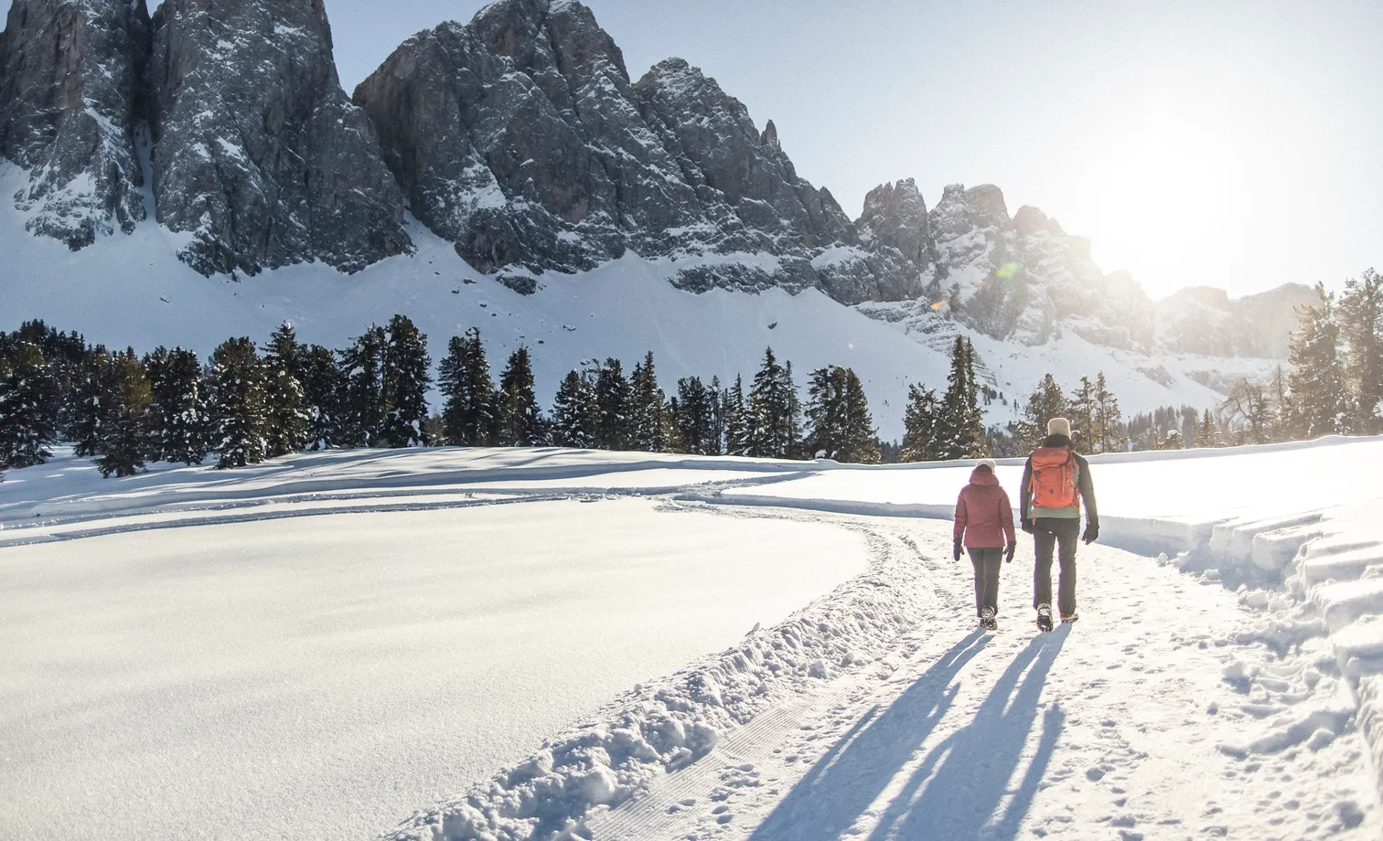 Winter hike in snow-covered Villnöß with view of the snow-covered Geisler Dolomites