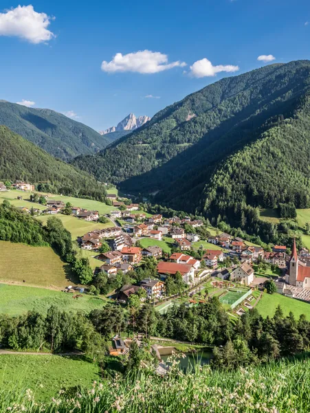 Hamlet Village in Luson in summer with parish church
