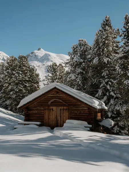 Winter landscape at Petrundergampl in the Dolomites with snow-covered alpine meadows and mountain panorama